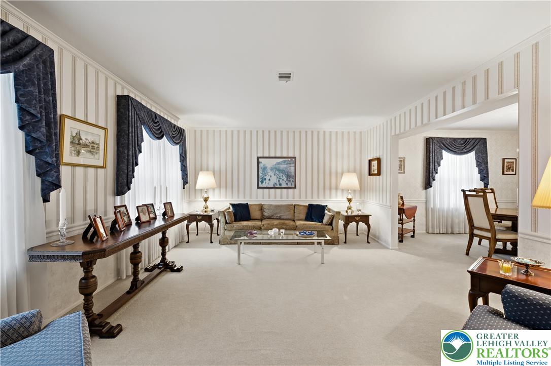 1700 Brandywine Road Allentown, PA 18104 - Photo 7 of 48 a living room with furniture gym equipment and a large window