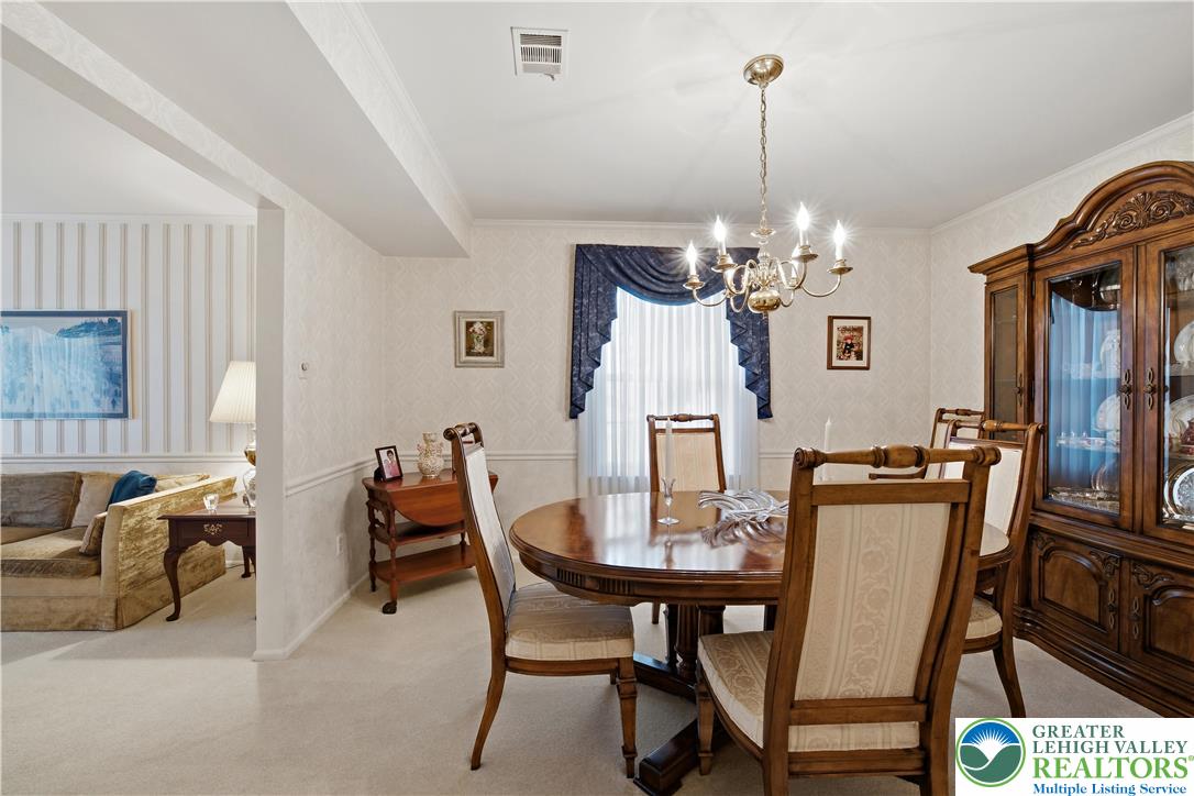 1700 Brandywine Road Allentown, PA 18104 - Photo 10 of 48 a view of a dining room with furniture and chandelier