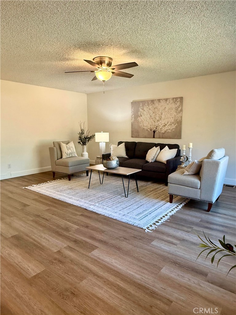 1094 Rey Circle Chico, CA 95926 - Photo 13 of 30 a living room with furniture and a chandelier