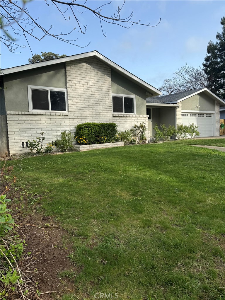 1094 Rey Circle Chico, CA 95926 - Photo 2 of 30 a front view of a house with garden