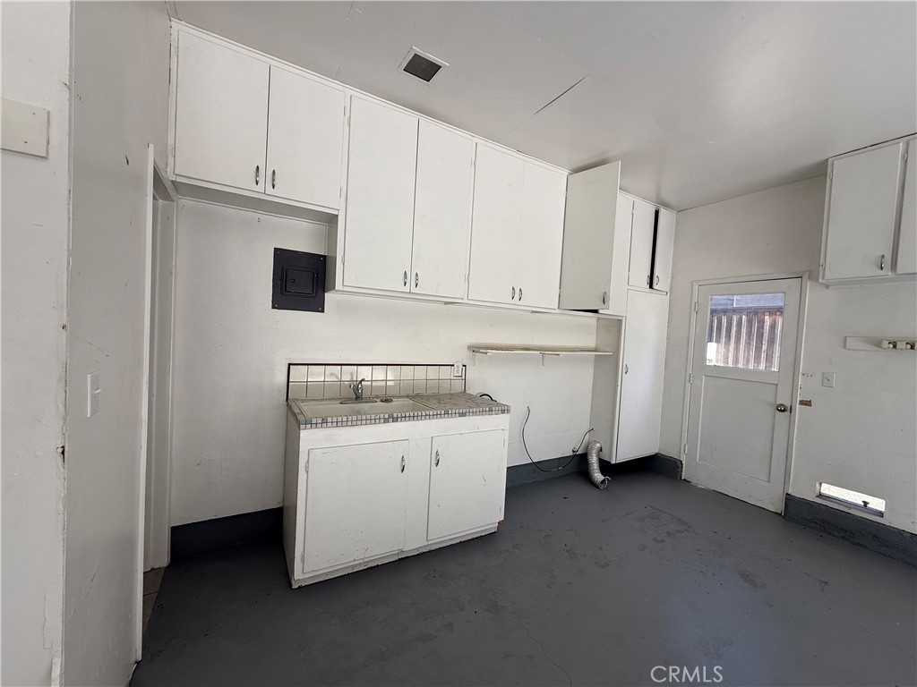 1094 Rey Circle Chico, CA 95926 - Photo 30 of 30 a kitchen with cabinets and white appliances