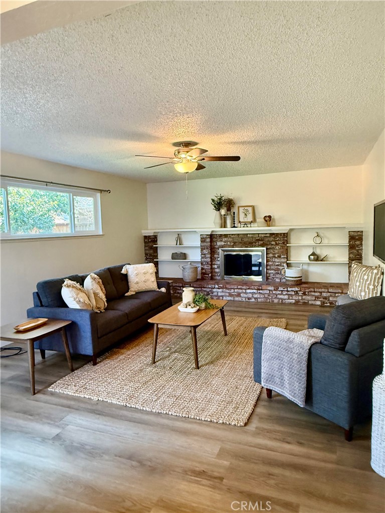 1094 Rey Circle Chico, CA 95926 - Photo 10 of 30 a living room with furniture and a fireplace