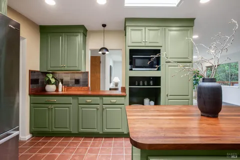 a kitchen with a sink and refrigerator