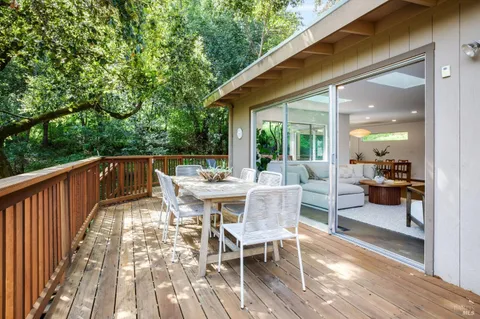 a view of a patio with a table and chairs