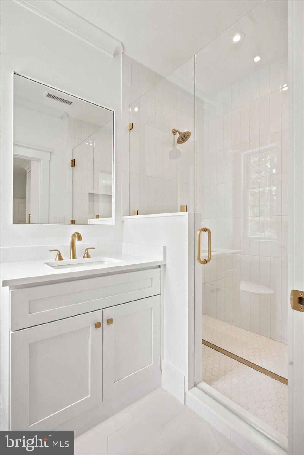 1756 Yellow Springs Road Malvern, PA 19355 - Photo 19 of 43 Elegant white bathroom with gold accents.