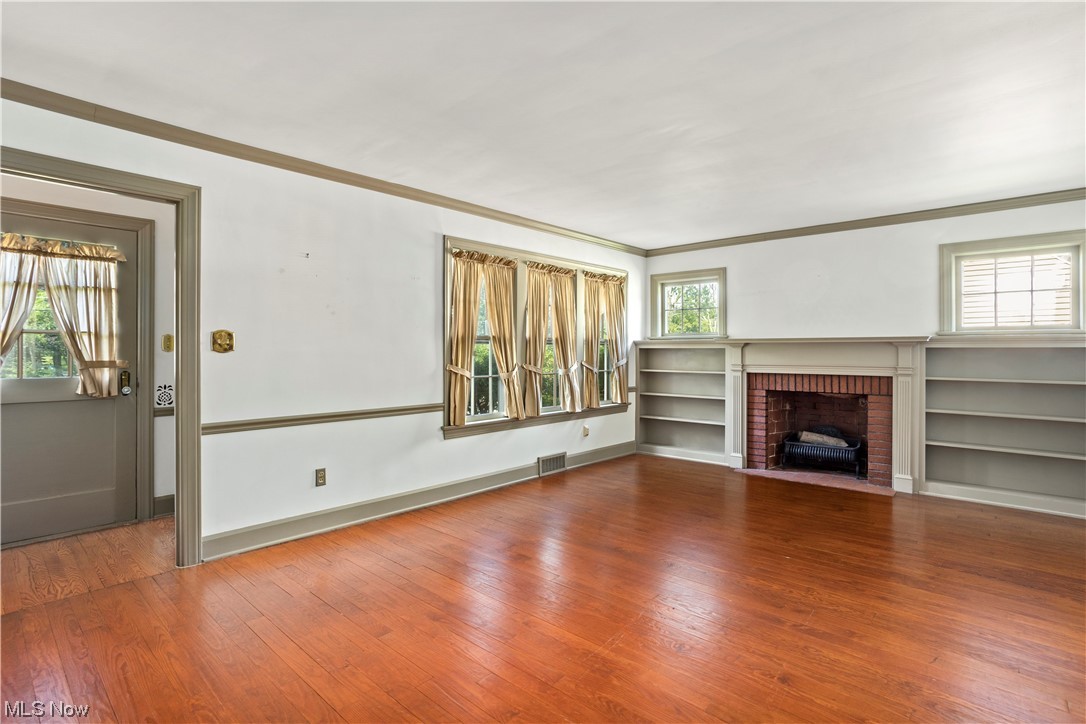1920 Grafton Road Elyria, OH 44035 - Photo 2 of 35 Lovely brick fireplace with custom built-in shelves in living room