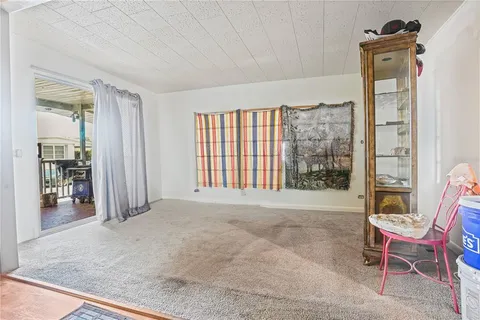 a view of an empty room with glass door