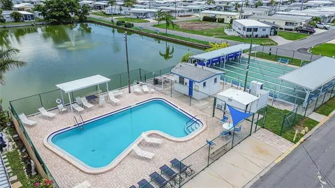an aerial view of a house with a lake view