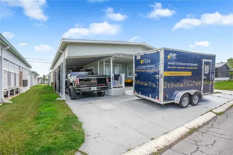 a view of a car park in front of house