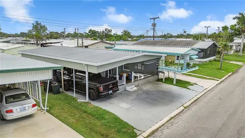 a view of a patio with table and chairs a barbeque