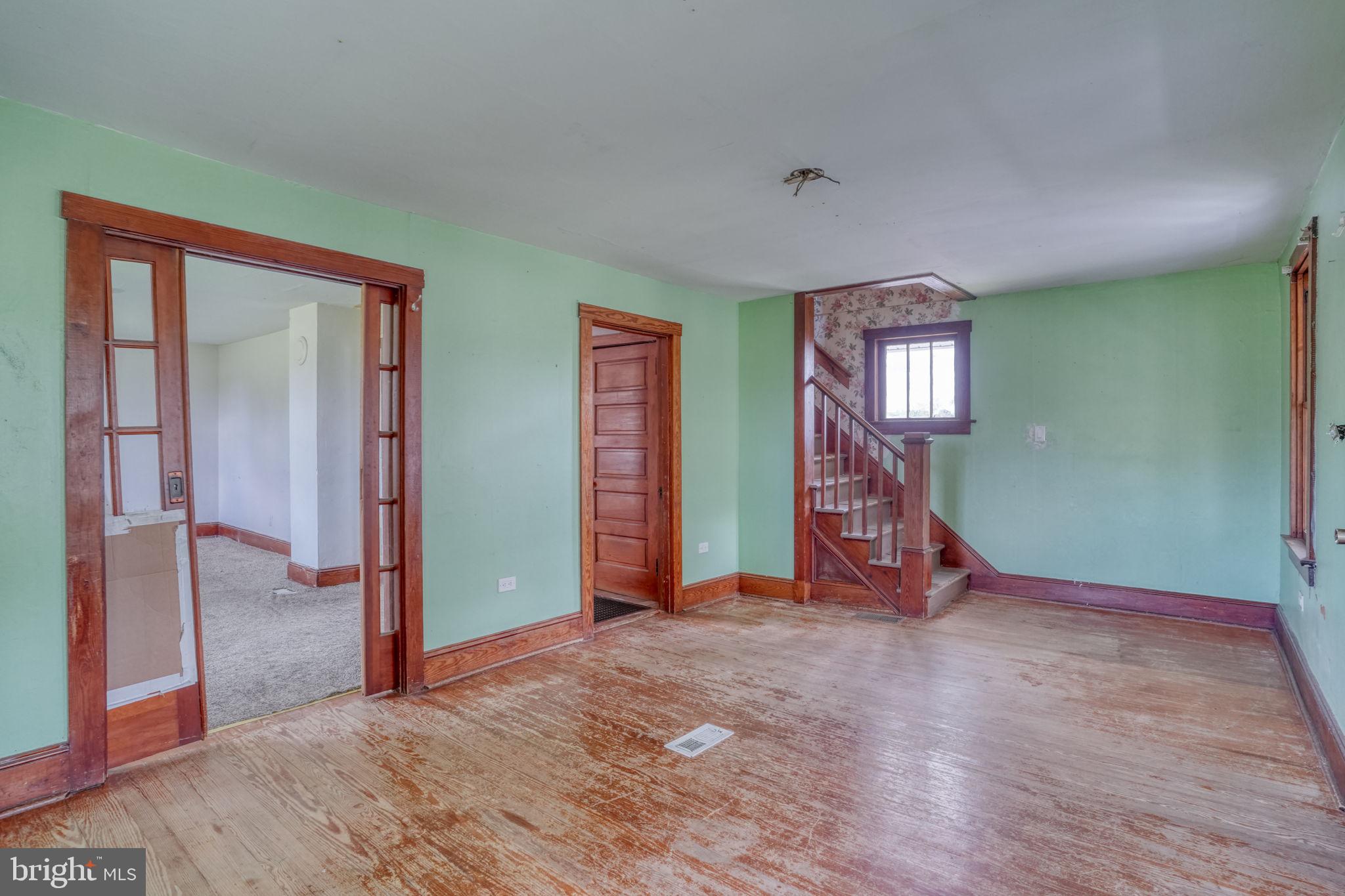 461 Hartly Road Hartly, DE 19953 - Photo 17 of 56 a view of an empty room with window and stairs