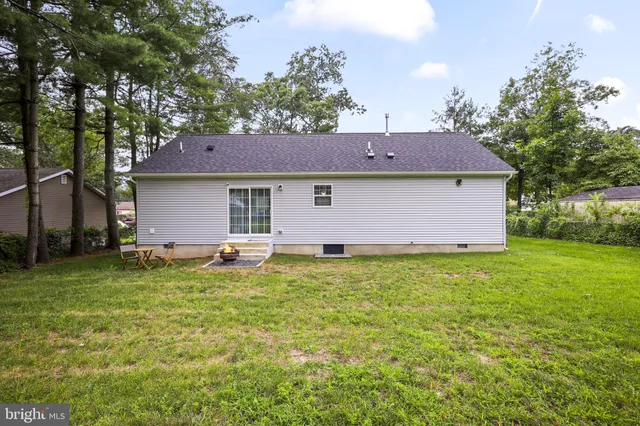 a backyard of a house with seating space