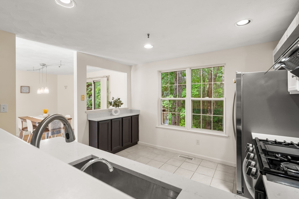 58 Meadowood Road North Andover, MA 01845 - Photo 13 of 31 a kitchen with a refrigerator and a sink