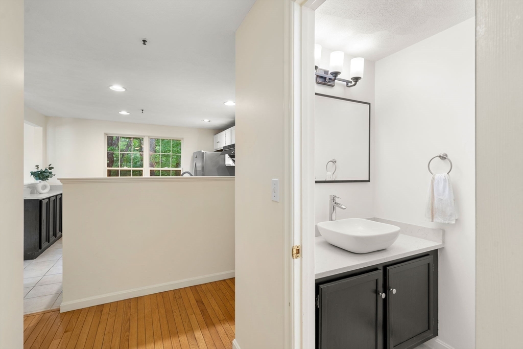58 Meadowood Road North Andover, MA 01845 - Photo 15 of 31 a bathroom with a sink a toilet and mirror