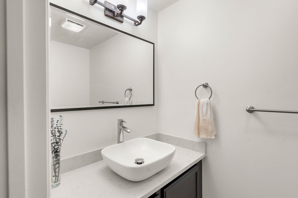 58 Meadowood Road North Andover, MA 01845 - Photo 16 of 31 a bathroom with a sink and a mirror