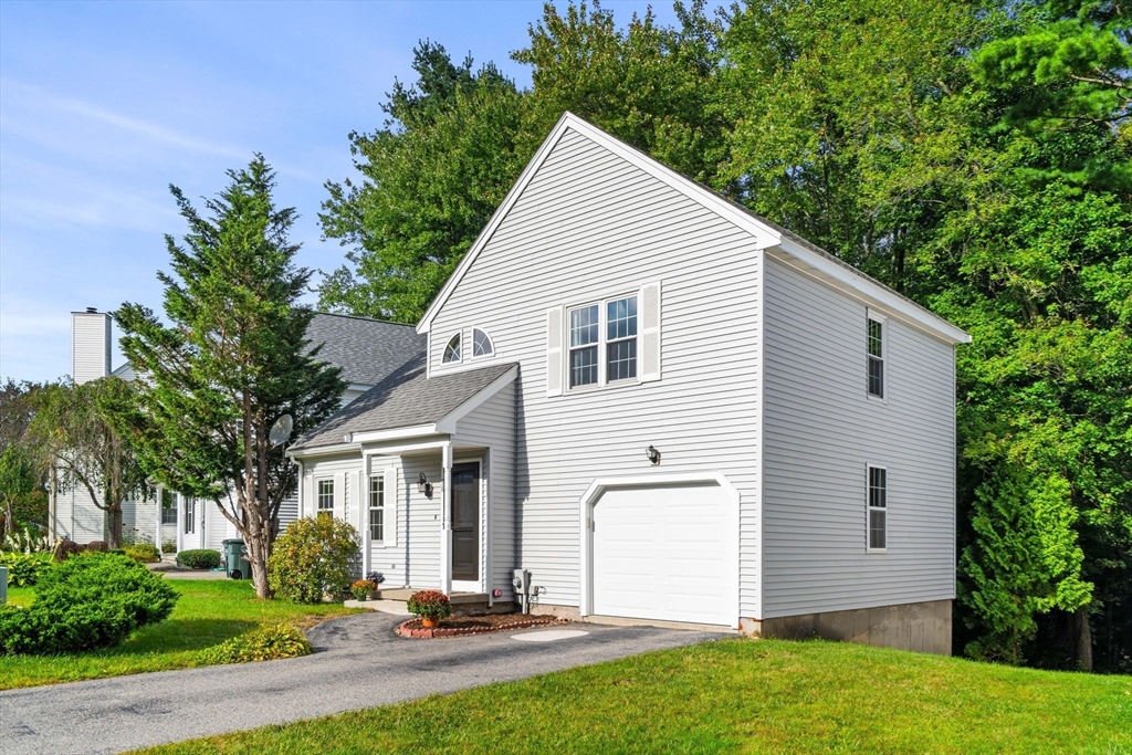 58 Meadowood Road North Andover, MA 01845 - Photo 2 of 31 a view of a white house with a yard and plants