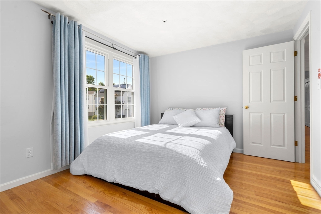 58 Meadowood Road North Andover, MA 01845 - Photo 23 of 31 a large bed sitting in a bedroom next to a window