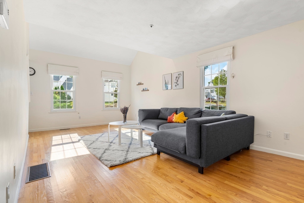 58 Meadowood Road North Andover, MA 01845 - Photo 6 of 31 a living room with furniture and a wooden floor