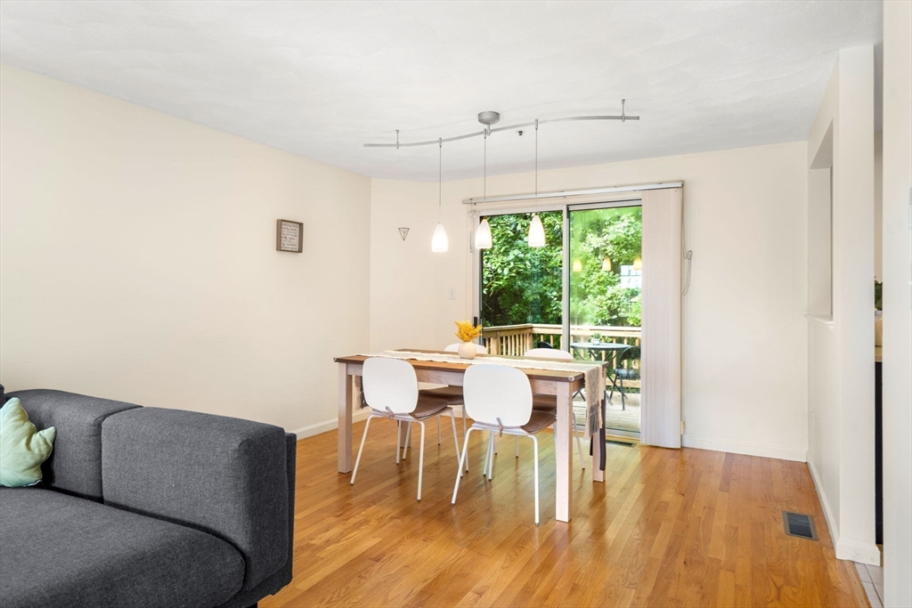 58 Meadowood Road North Andover, MA 01845 - Photo 7 of 31 a view of a dining room with furniture and wooden floor