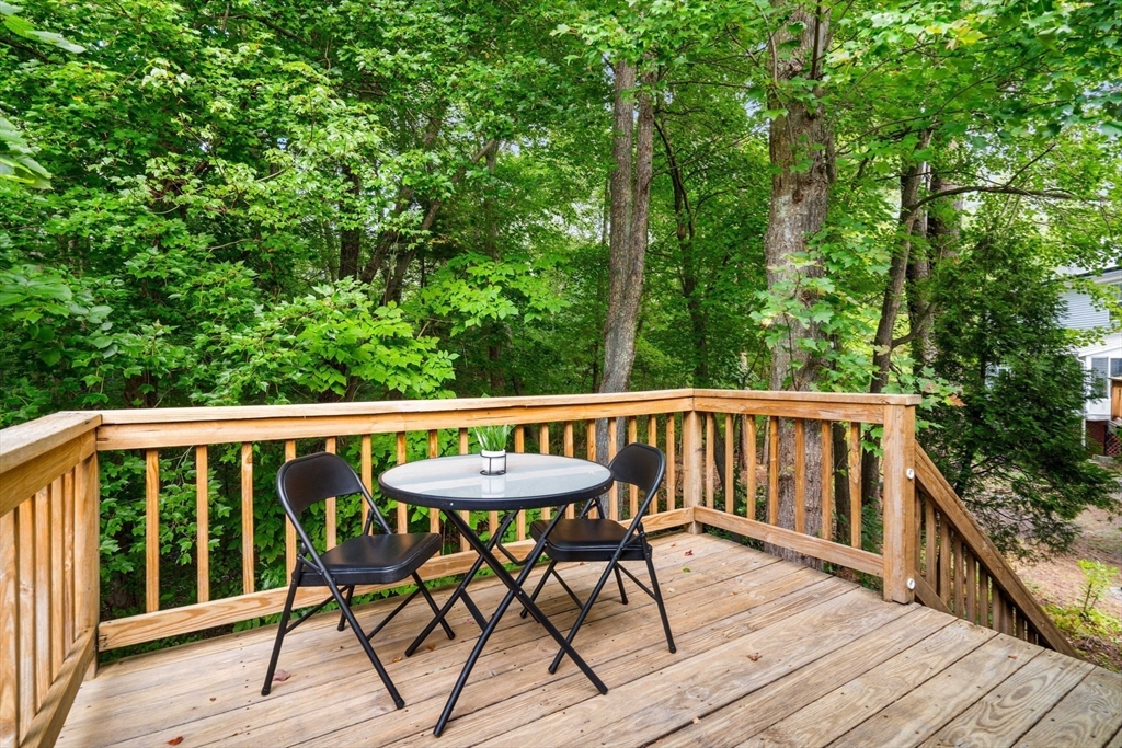 58 Meadowood Road North Andover, MA 01845 - Photo 10 of 31 a view of a chairs and table on the deck