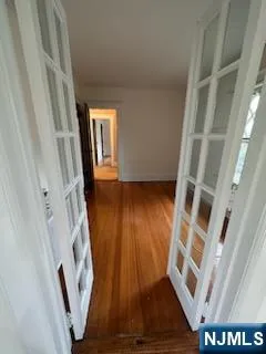a view of an entryway with wooden floor