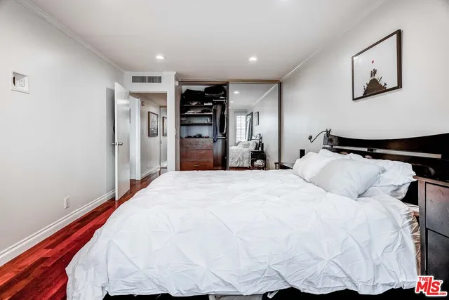 a bedroom with a bed and closet