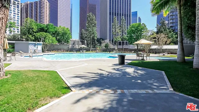 a view of a fountain in front of a house