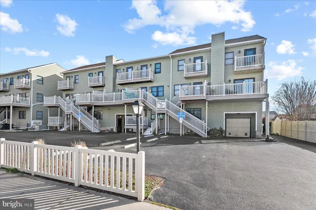 a view of a house with iron stairs