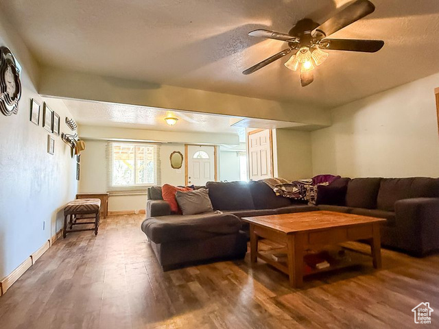 425 East Mule Deer Road Central, UT 84722 - Photo 34 of 72 Living area with wood finished floors, a ceiling fan, and baseboards