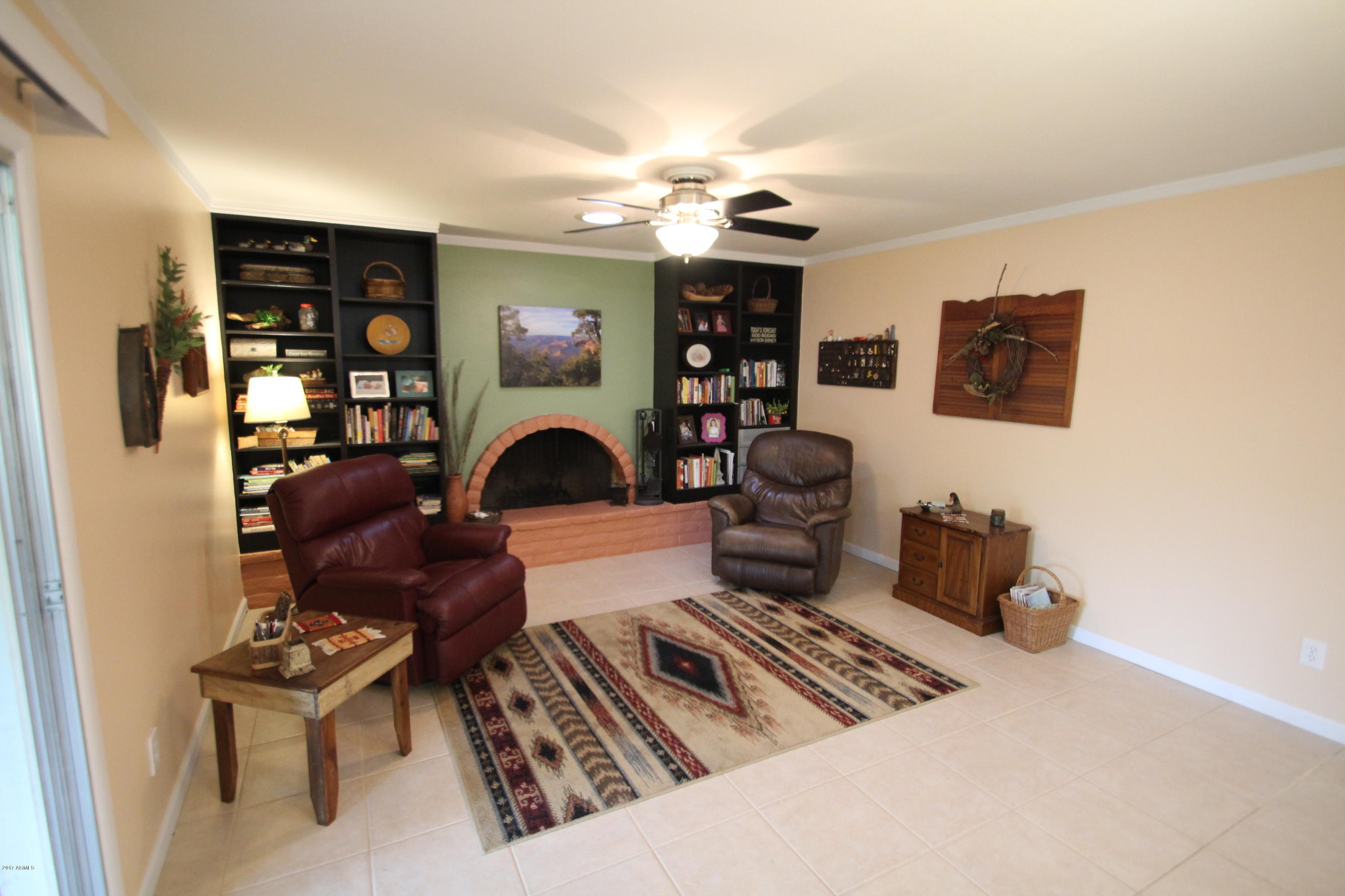 1643 West Royal Palm Road Phoenix, AZ 85021 - Photo 12 of 39 family room with wood burning firepla