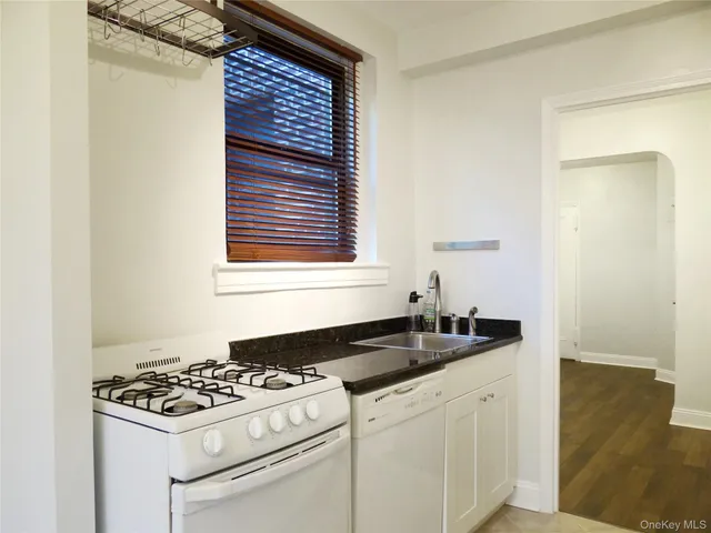 a kitchen with a stove and a sink