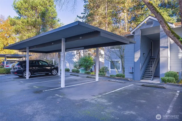 a view of a house with porch and garden