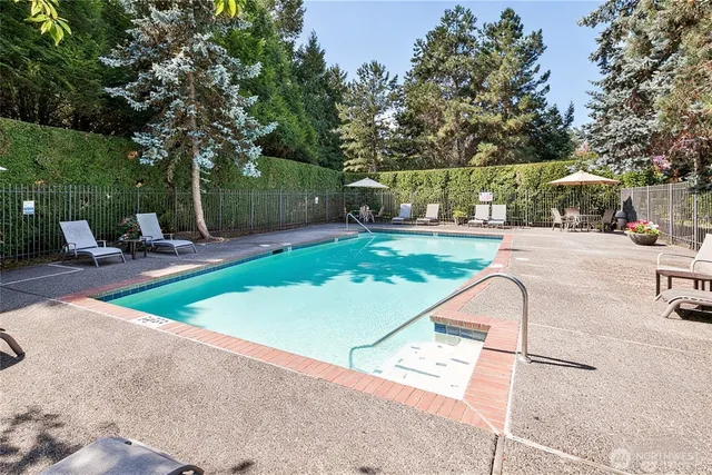 a view of a backyard with sitting area