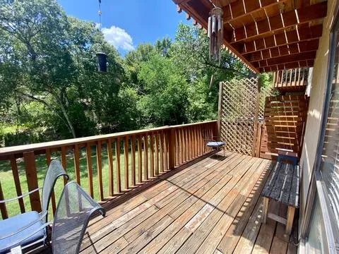a balcony with wooden floor