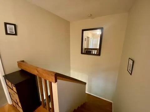 a view of an entryway with wooden floor