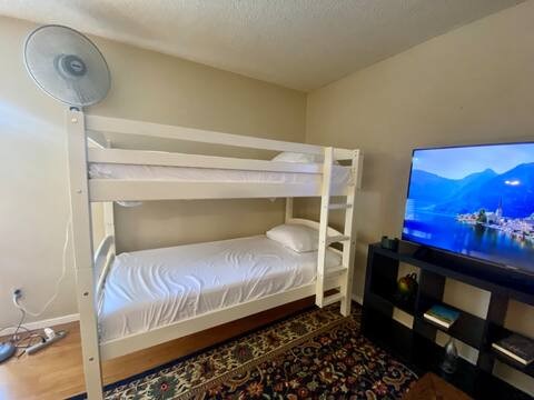 903 The High Road Austin, TX 78746 - Photo 19 of 39 a bedroom with a bed and a window