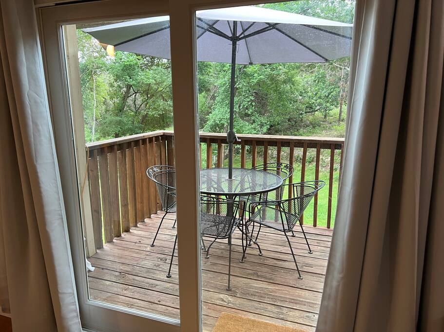 903 The High Road Austin, TX 78746 - Photo 21 of 37 a balcony view with a table and chairs