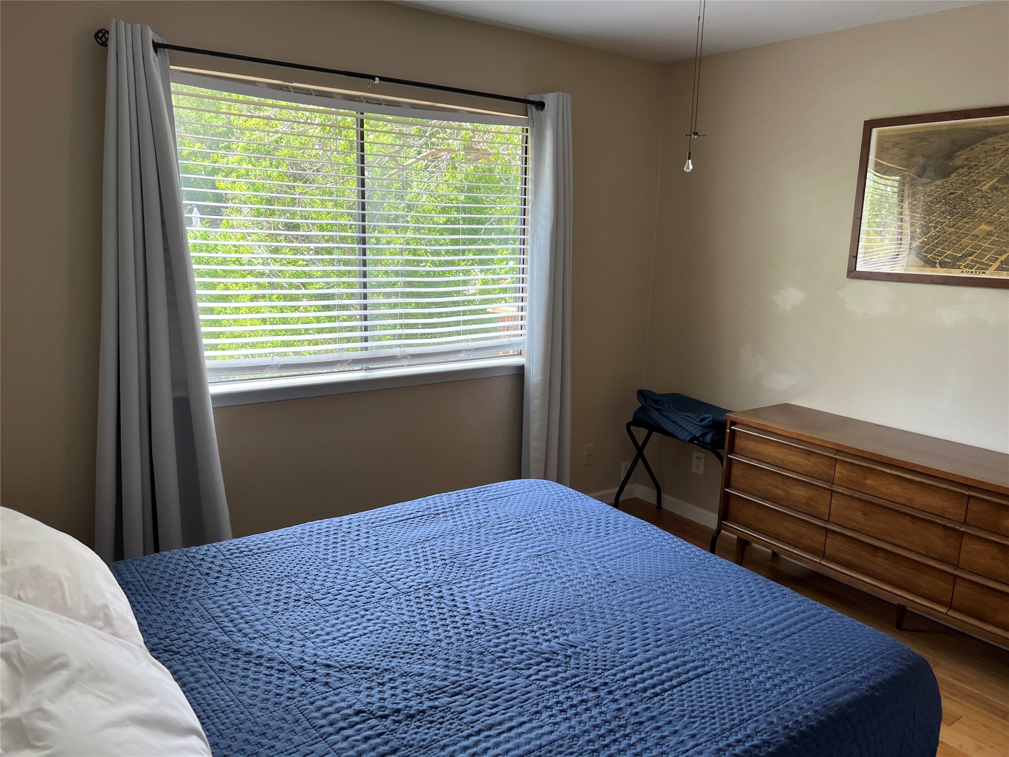 903 The High Road Austin, TX 78746 - Photo 26 of 37 a bedroom with a bed and a window
