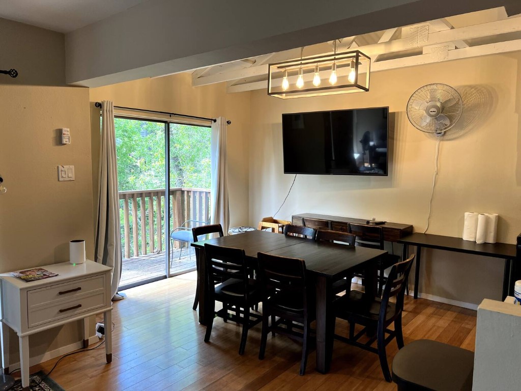 903 The High Road Austin, TX 78746 - Photo 32 of 39 a view of a dining room with furniture and wooden floor
