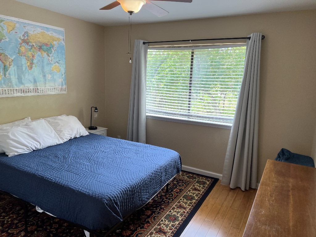 903 The High Road Austin, TX 78746 - Photo 35 of 39 a bedroom with a bed and a window