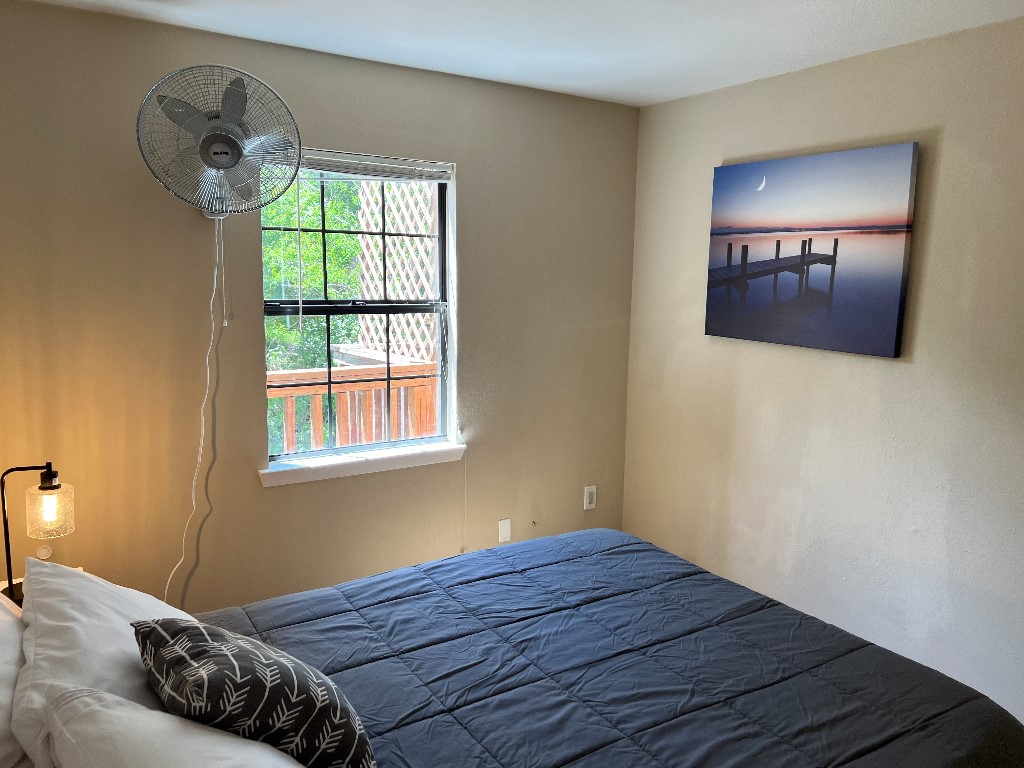 903 The High Road Austin, TX 78746 - Photo 38 of 39 a bedroom with a bed and a window