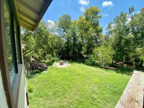 903 The High Road Austin, TX 78746 - Photo 8 of 39 a view of a yard with potted plants