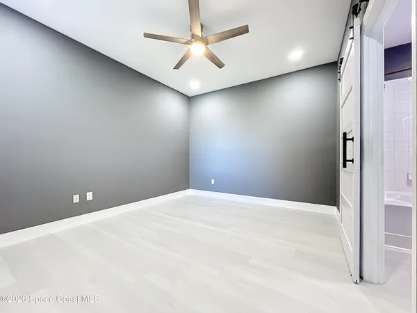 a view of a livingroom with a furniture and chandelier