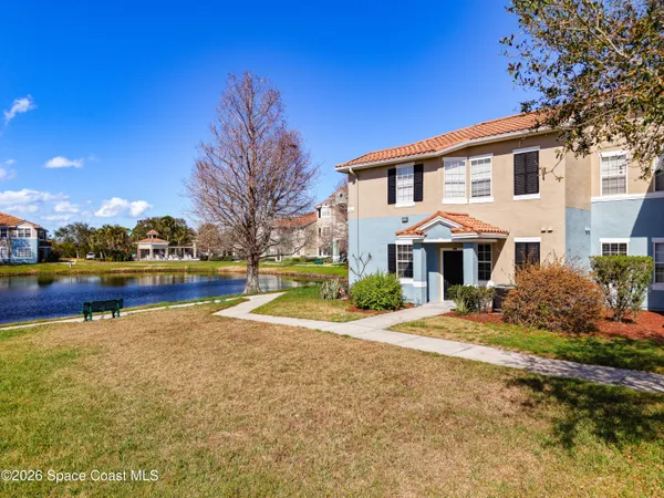 a view of a house with pool and yard