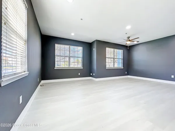 a view of empty room with windows
