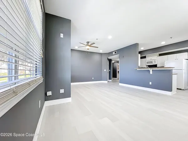 a view of a kitchen with furniture and windows