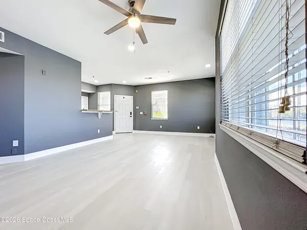 a view of an empty room with a window