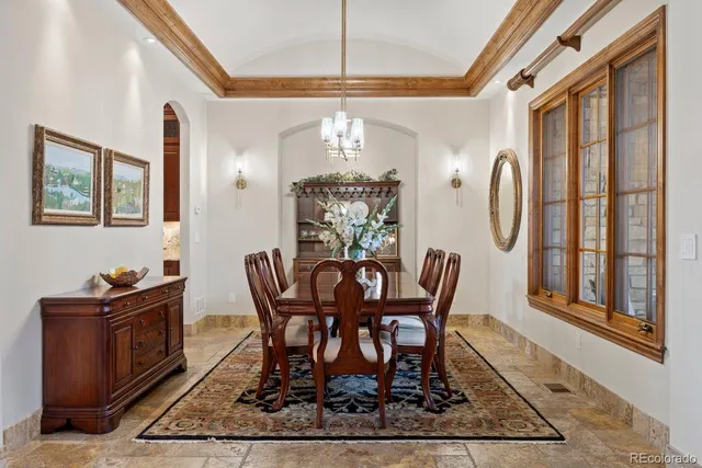 a kitchen with granite countertop a sink a stove and a wooden cabinets