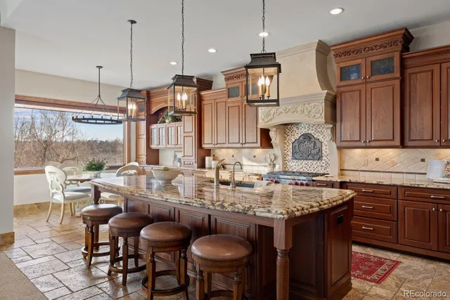 a living room with furniture and a view of kitchen