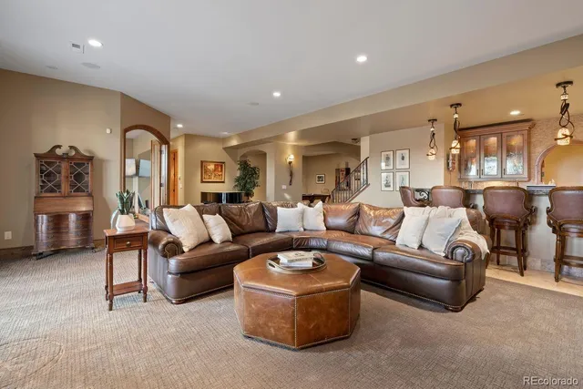 a room with pool table and windows